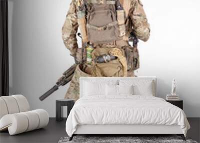 Armed army soldier standing backwards studio shoot Wall mural