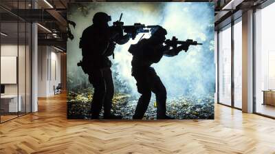 Black silhouettes of pair of soldiers in the smoke haze moving in battle operation. Back light Wall mural