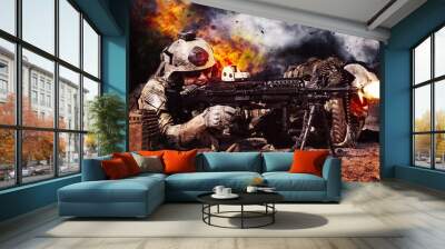 two crewman of machine gun crew firing in the desert. explosions fire shrapnel and clouds of black s Wall mural