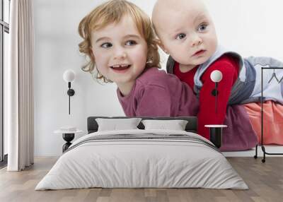 two children playing on floor Wall mural