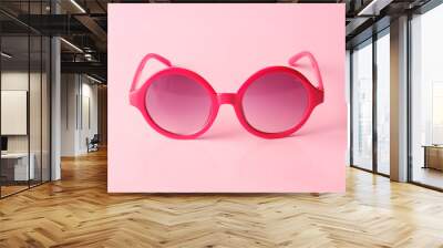 Red glasses on pink  background with copy space Wall mural