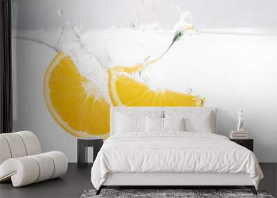 Two lemon slices splash in water on white Wall mural