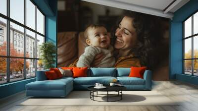 A woman is holding a baby, smiling and looking happy Wall mural