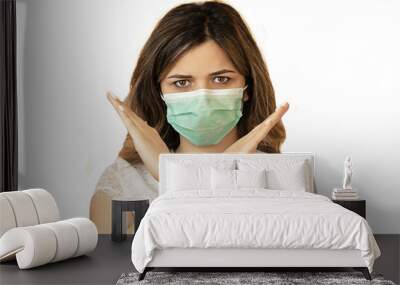 Stop the virus and epidemic diseases. Healthy woman in blue medical protective mask showing gesture stop. Wall mural