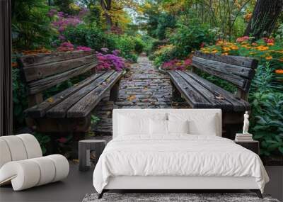 Two wooden benches flanking a stone path in a lush autumnal garden. Wall mural