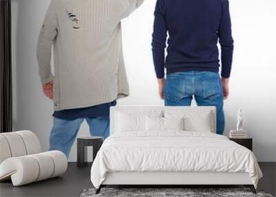 Back view of two man in sweater pointing. Wall mural