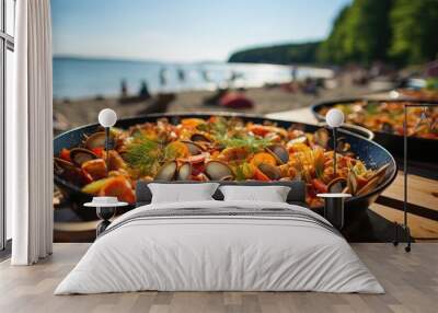 Paella or bar food in summer on the beach  Wall mural