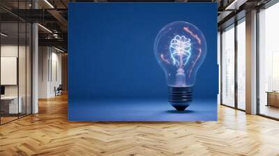  A clear glass light bulb with a warm, glowing filament against a clean background. concept of idea  Wall mural