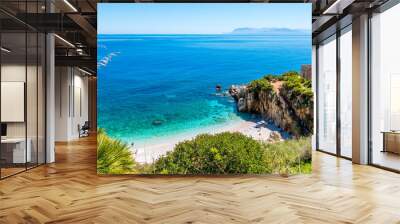 The paradise beach: clear turquoise sea water, white pebbles beach and a house on the beach, at the natural reserve of “Riserva dello Zingaro, San Vito lo Capo, Sicily, Italy. Wall mural