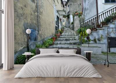 A narrow street among the old houses of Montesarchio, a village in the province of Benevento in Italy. Wall mural