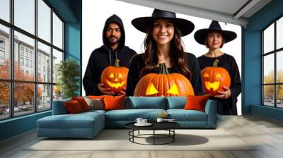 A girl in the foreground dressed as a Halloween witch holding a large pumpkin in her hand in the background there are two other friends dressed in the same style, png image with transparent background Wall mural