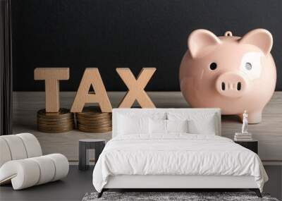 Close up of stacked coins leading to piggy bank with tax letters Wall mural