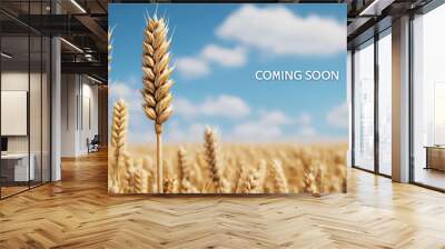 Golden wheat field swaying in wind under blue sky, symbolizing harvest time and abundance. Wall mural