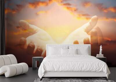 Human hands with open palms reaching from colorful sky, symbolizing connection to heaven and spirituality Wall mural