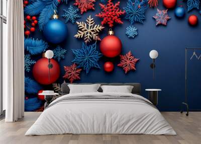 A blue background with red and blue snowflakes and red and blue Christmas ornaments. Wall mural