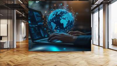 A business professional using a laptop with a digital blue hologram of a global map and data Wall mural