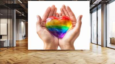 A person holding a rainbow heart in their hands. Wall mural