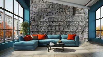 Wall of miniature Buddhas carved in stone. Wall mural