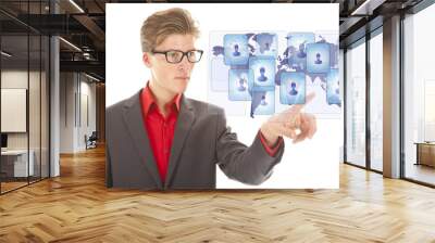 Young business man selecting virtual worldwide friends isolated on white background Wall mural