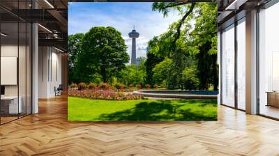 Observation deck tower above gardens in skyline of Niagara Falls City in Ontario, Canada Wall mural