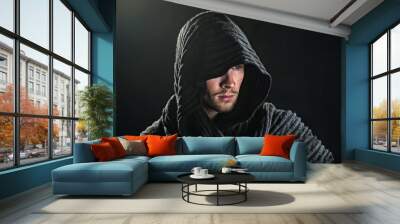 a bearded man in a hood. Wall mural