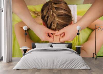 Woman having neck and shoulder massage in spa center Wall mural