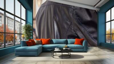 Men's casual black leather jacket on a mannequin back closeup Wall mural