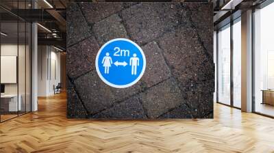 2 meter distance, social distancing sign. Covid 19 precautions  Wall mural