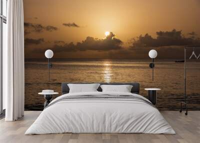 Paynes Bay Beach, Barbados: an amazing colorful sunset in the caribbean sea. Wall mural