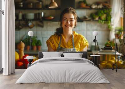 A young woman cooks in the kitchen Wall mural