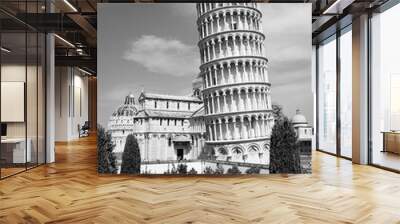 Black and white photo showing the leaning tower of Pisa and other historical buildings at miracles square Wall mural