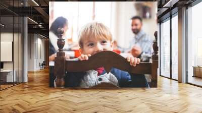 cute playful child at christmas dinner Wall mural