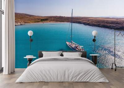 Blue water in the bay on the southwest coast of the Greek island of Rinia in the Cyclades Wall mural