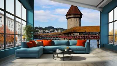 Wooden bridge with an orange rooftop and a tower over a lake Wall mural