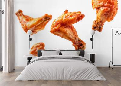 In a dynamic, high-end advertising golden-brown, juicy chicken wings float mid-air against a crisp white background. The wings show slight motion blur, capturing the moment of fligh Wall mural