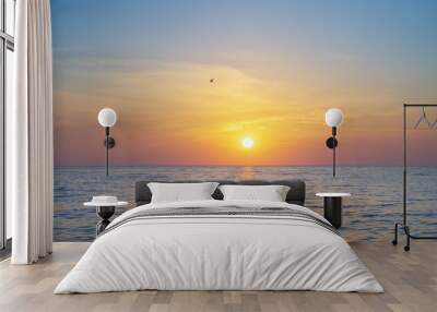 Sun and sea sunset background. Wall mural