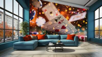 A pair of aces, hearts and clubs, fall onto a table with a stack of colorful casino chips, surrounded by bokeh lights. Wall mural