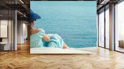 Banner Young woman with hat on the white rocks on the beach Sicily Wall mural