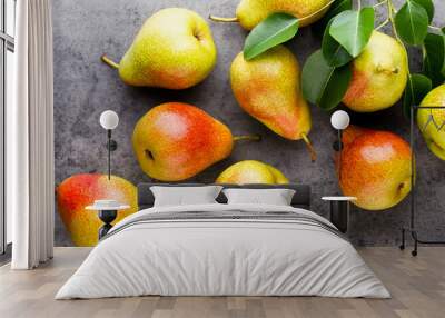 Fresh bio pear with leaves on the plate. Gray stone table. Wall mural