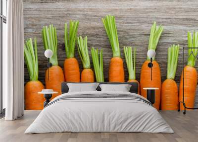 Fresh carrots bunch on rustic wooden background. Wall mural