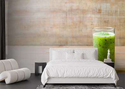 Healthy green smoothie in a glass on old wood. Wall mural