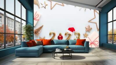 New year 2023 number, golden digits and santa hat over blue background. Wall mural