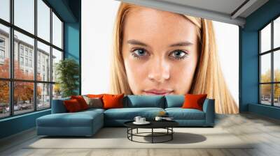 Attractive young girl staring intently at camera Wall mural