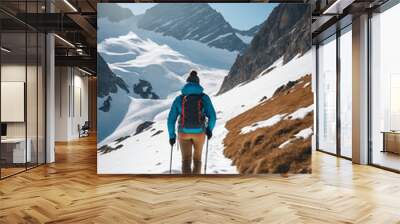 A close-up view from behind, candid photo of a person hiking on snow in the mountains in the vacation trip week Wall mural