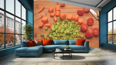 Sliced Carrots, Tomatoes And Celery On A Wooden Table Wall mural