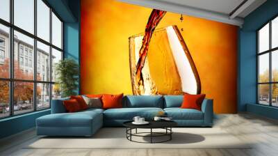 Red wine on orange background Wall mural