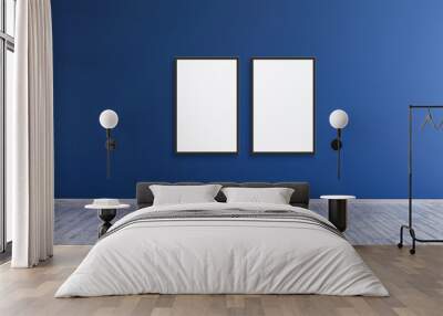 2 empty vertical black frame mockup design on a blue wall room for prints and photos. Wall mural