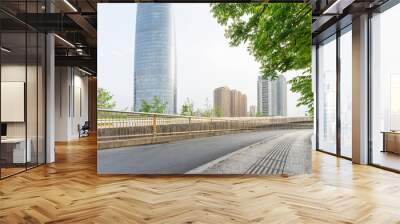 Empty urban road and buildings in the city Wall mural