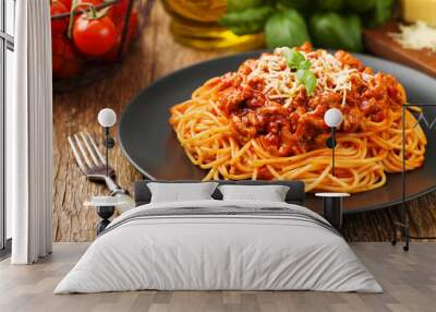 Delicious spaghetti served on a black plate Wall mural