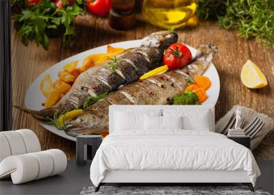 Grilled whole trout. Served with baked potatoes. Wall mural